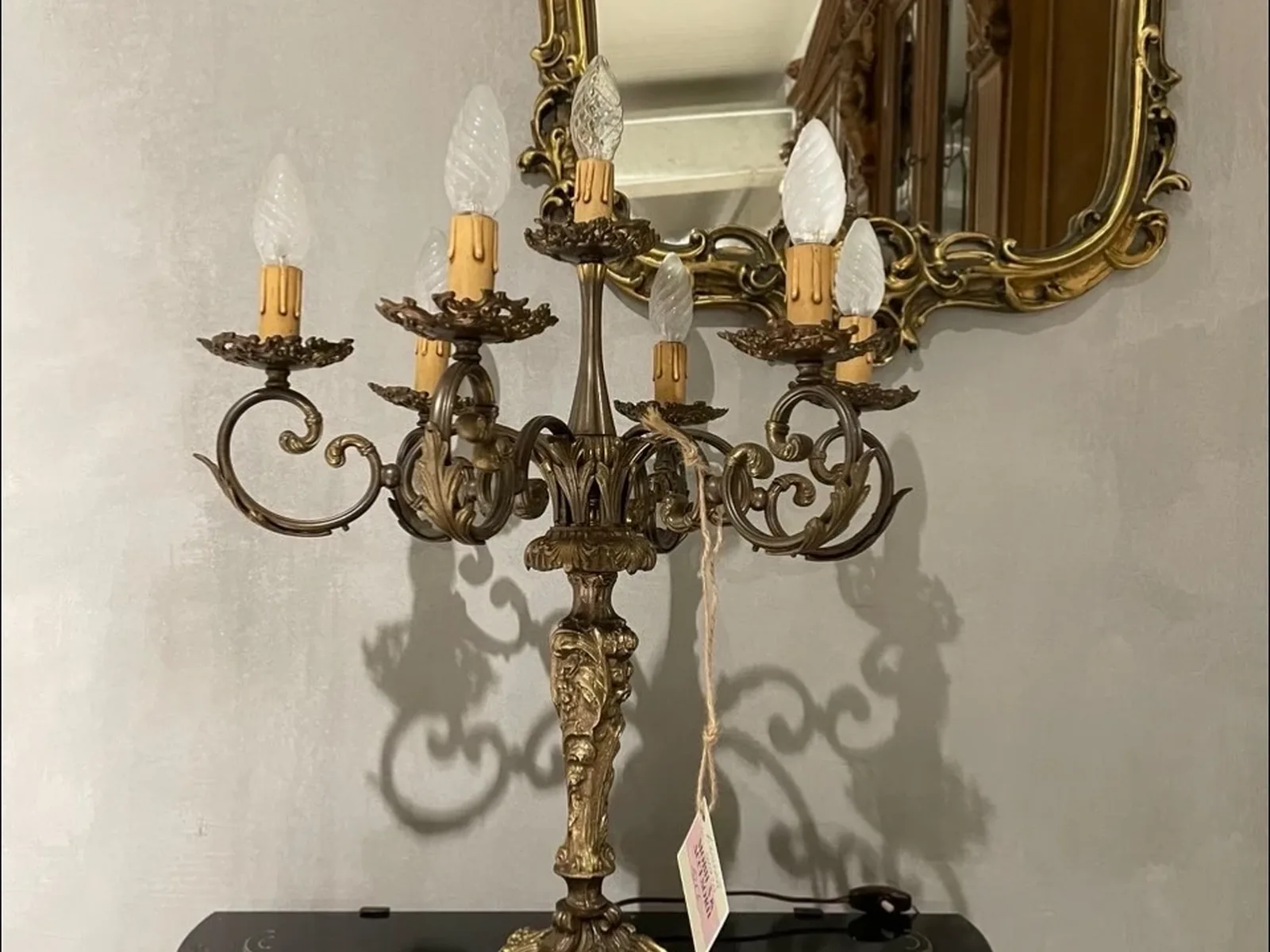 Vintage candlestick-style lamp, a lighting accent suited next to a bar cart in the evening